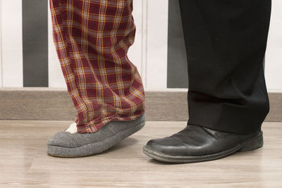 Low section of man standing on floor