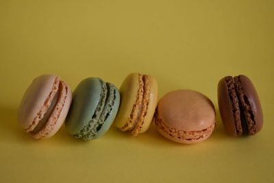 Close-up of cookies against yellow background