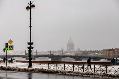 View of bridge and buildings against sky