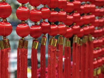 Close-up of red bell hanging in temple