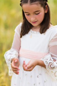 High angle view of young woman standing on field