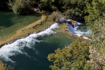 High angle view of waterfall in forest