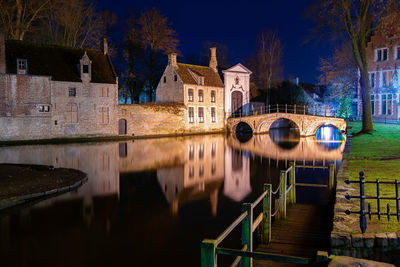 Reflection of building on water at night