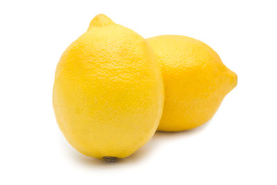 Close-up of oranges against white background