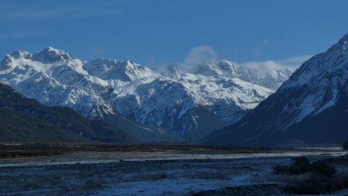 Scenic view of snowcapped mountains against sky