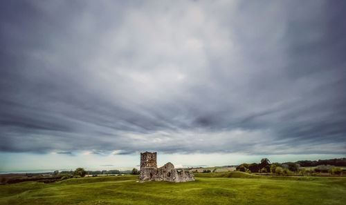 Old building against cloudy sky