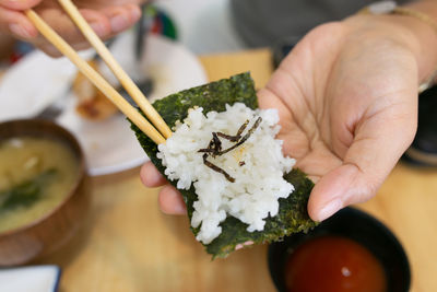 Cropped hand holding food