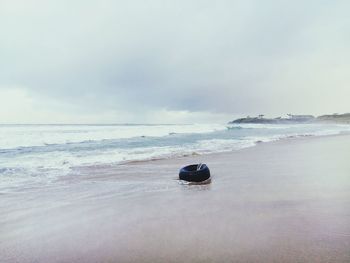 Boat on beach against sky