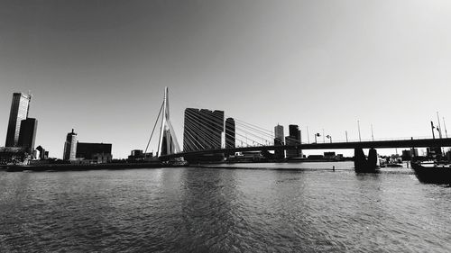 View of suspension bridge with city in background