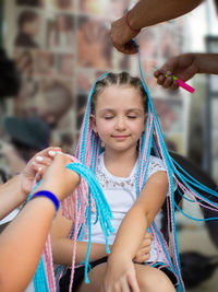 Low angle view of girl holding rope