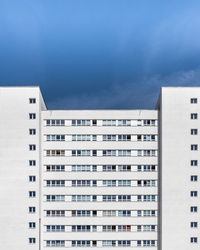 Residential buildings against blue sky