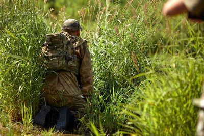 Rear view of man standing on field