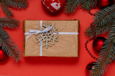 Directly above shot of christmas decorations on red background