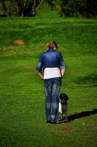 Rear view of woman on field
