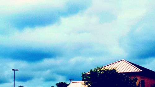 High section of building against cloudy sky