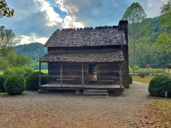 Exterior of house on field against sky