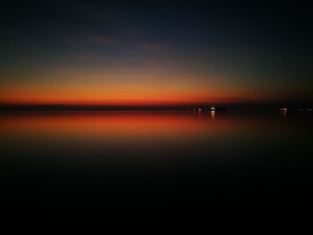 Scenic view of sea against sky at sunset