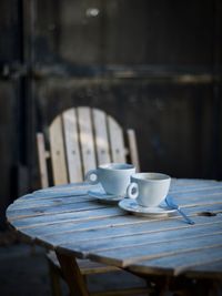 Cups on wooden table