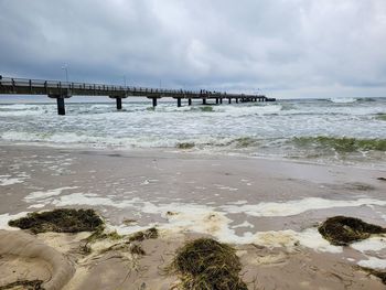 Pier over sea against sky