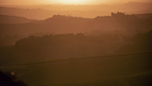 Scenic view of landscape against sky during sunset