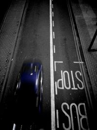 High angle view of road sign on street