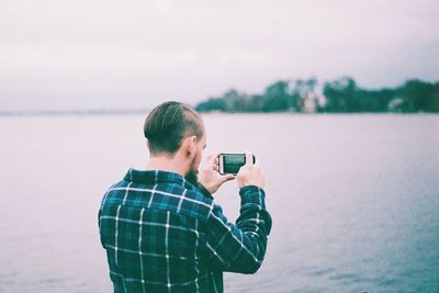 Woman photographing through camera