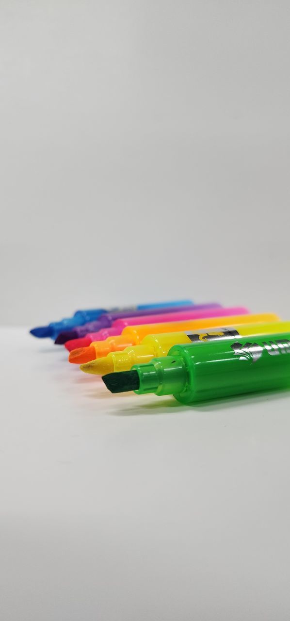 multi colored, indoors, pencil, no people, studio shot, writing instrument, white background, close-up, colored pencil, still life, creativity, variation, green, copy space, office supply, education, office, gray background, art