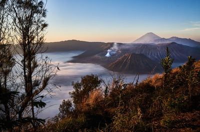 Scenic view of mountain against sky during sunset