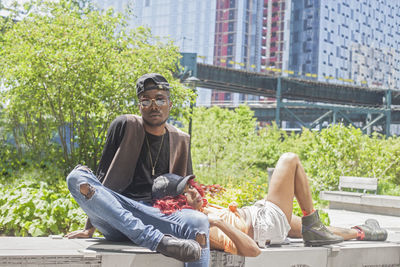 Portrait of young man sitting outdoors