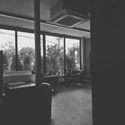 Empty chairs and tables in building