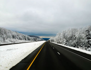 Road against sky during winter