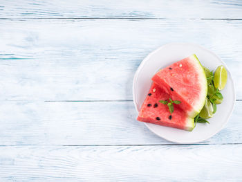 High angle view of fruits in plate on table