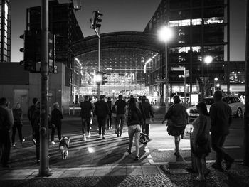 People walking on street at night