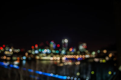 Defocused image of illuminated city at night