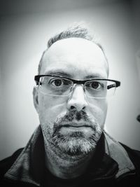 Portrait of man wearing eyeglasses
