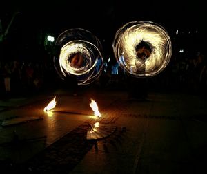 Illuminated fire crackers at night
