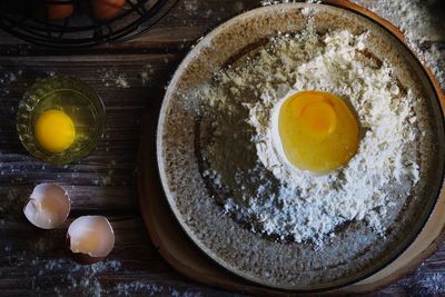 High angle view of egg in bowl on table