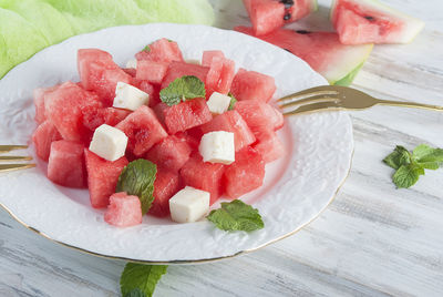 Close-up of chopped watermelon in plate on table