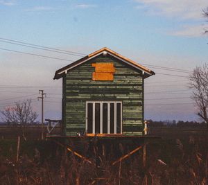 House on field against sky