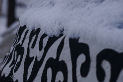 Close-up of text on snow