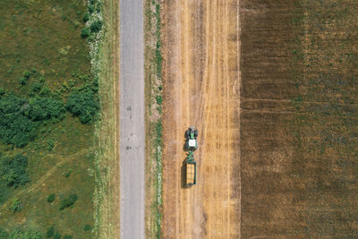 Tractor on a field. aerial top view. organic products concept. agriculture industry.