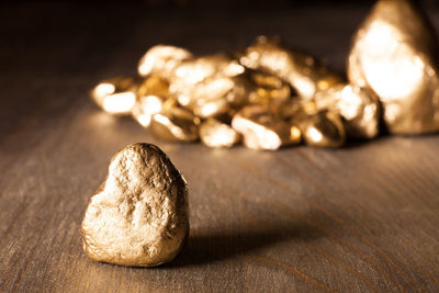 Close-up of shiny stone on table