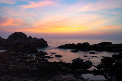 Scenic view of sea against sky during sunset