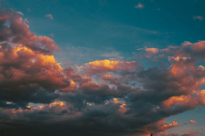 Low angle view of dramatic sky during sunset