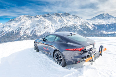 Car on snow covered mountains