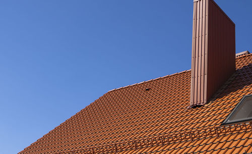 Low angle view of building against blue sky