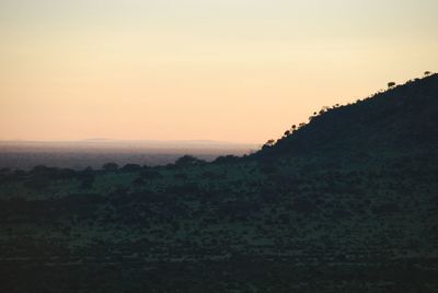 Scenic view of landscape at sunset