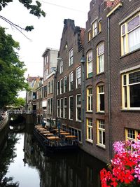 Canal amidst buildings in city