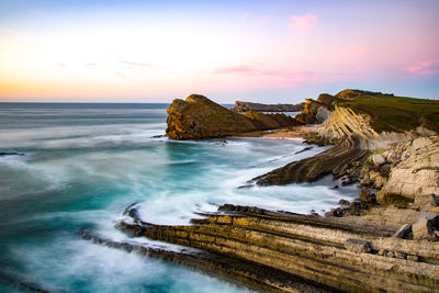 Scenic view of sea against sky during sunset