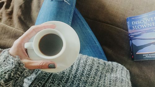Close-up of woman holding coffee